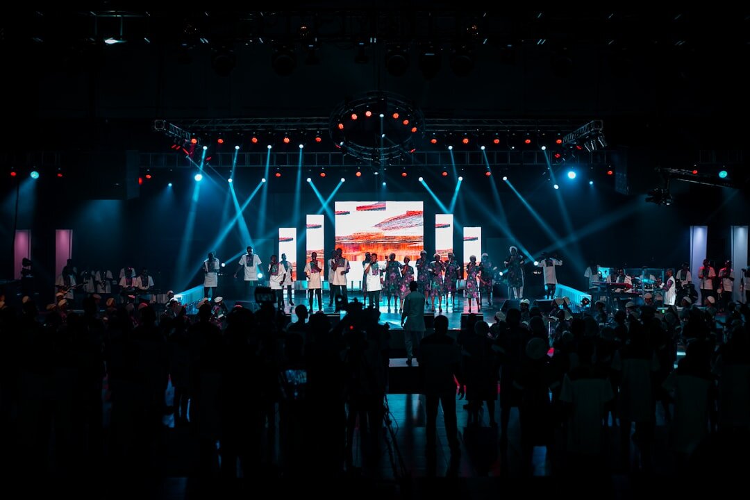 Award show stage with bright spotlights and audience